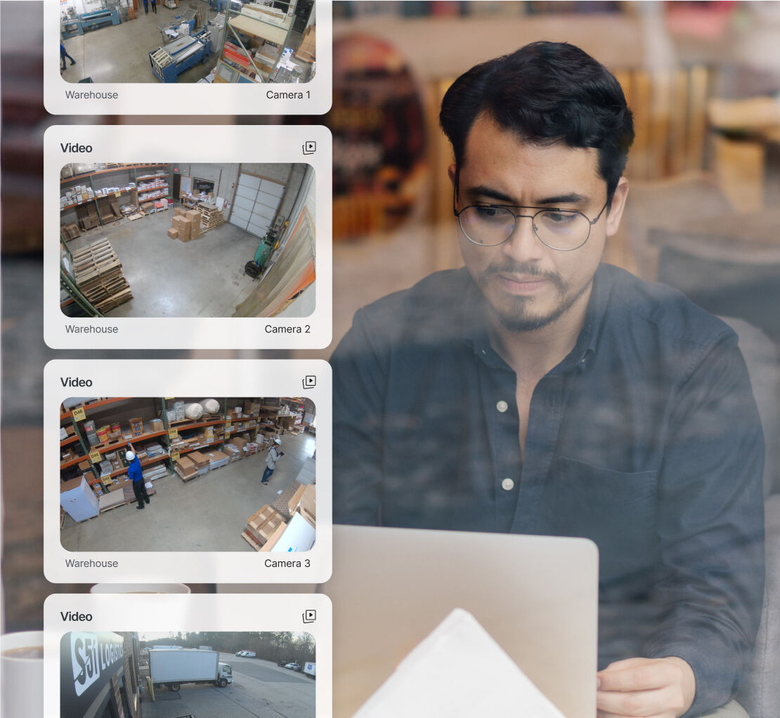 Man reviewing camera footage on his computer