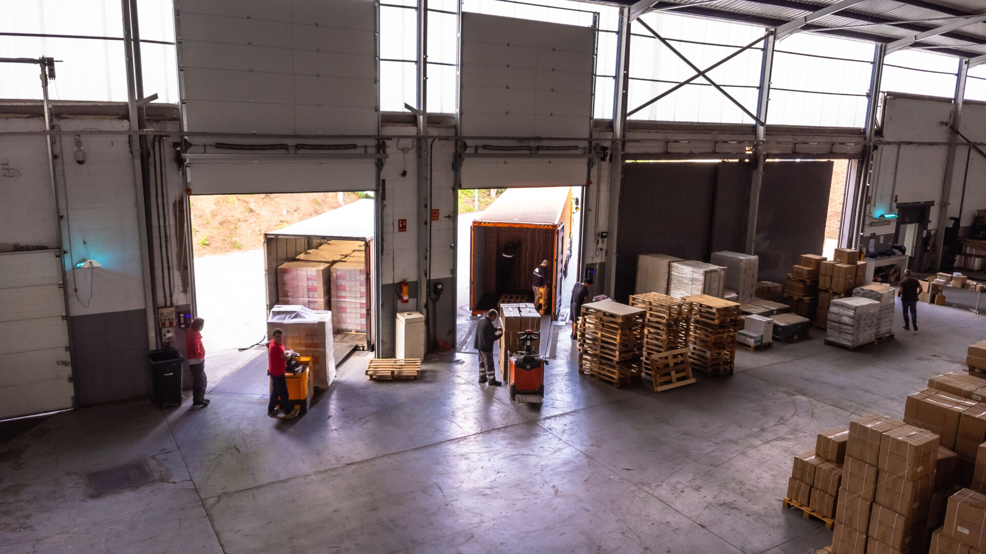Aerial view of the interior of a distribution warehouse with people working