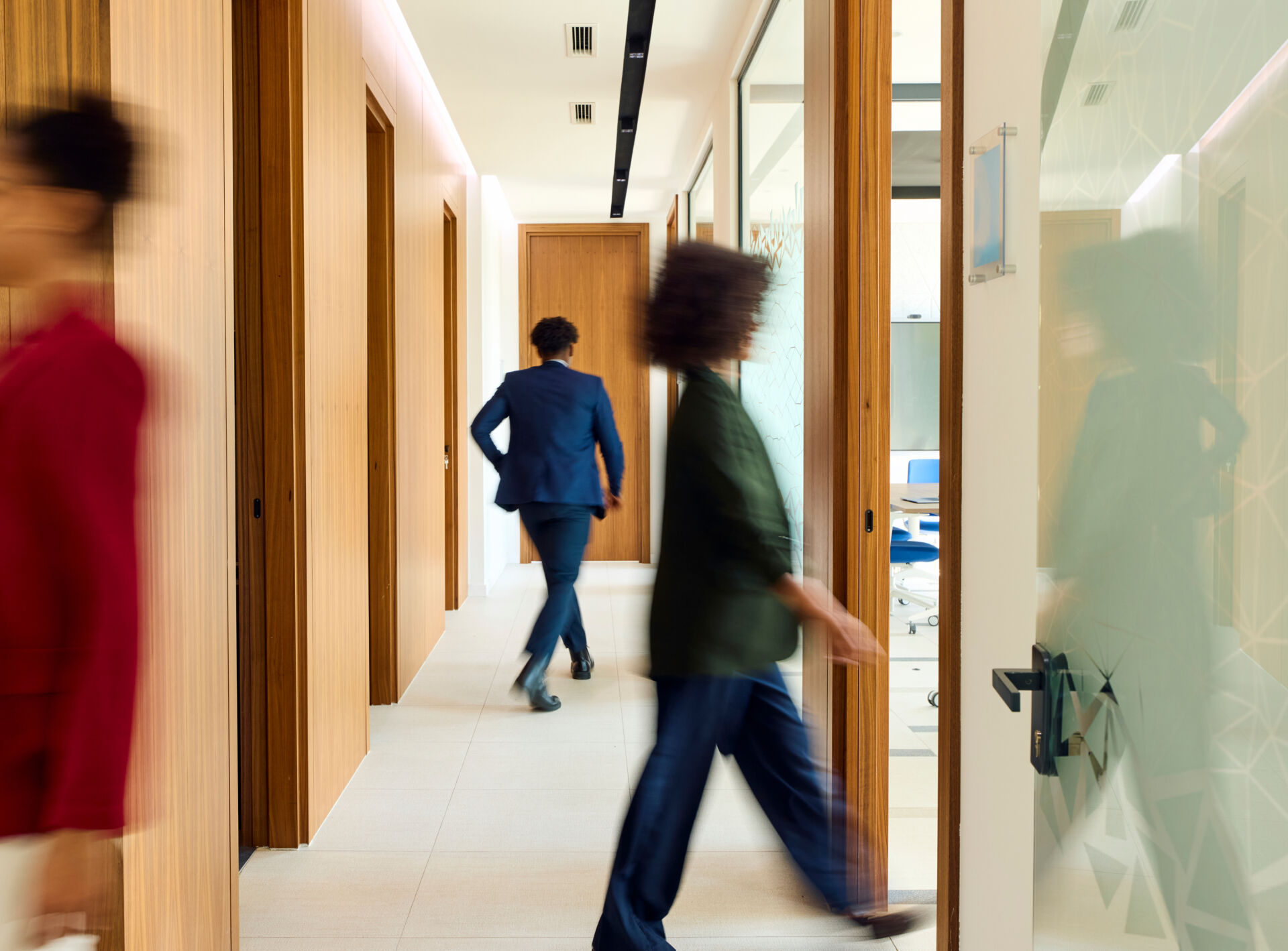 People walking in a hallway