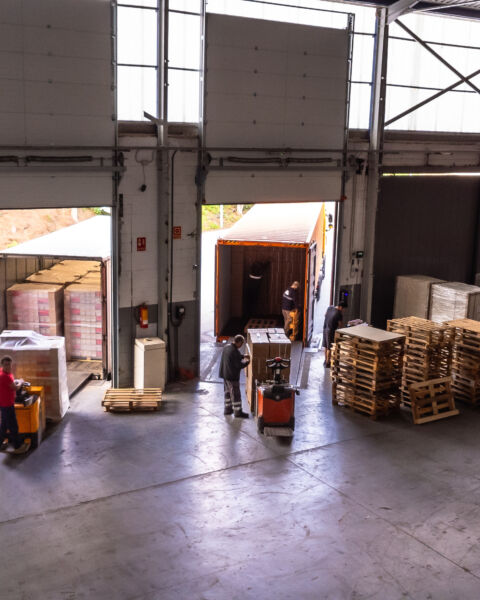 Aerial view of the interior of a distribution warehouse with people working