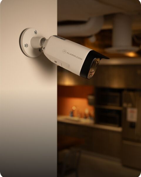 Commercial bullet security camera mounted on an exterior wall