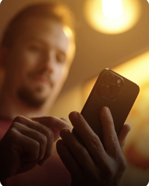 Person checking their security system on a phone app