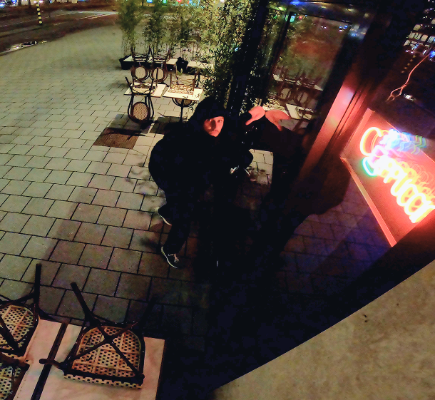 Person outside a building during night