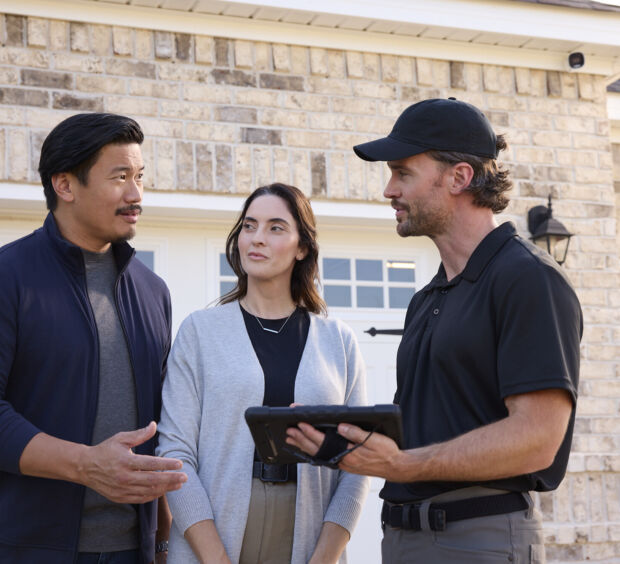 A local professional showing homeowners options on a tablet