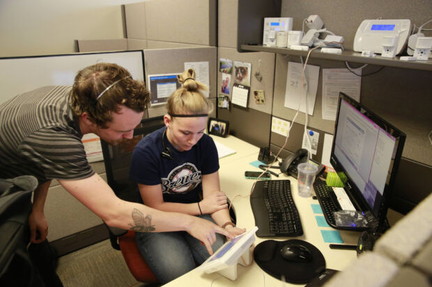 people working at a desk together